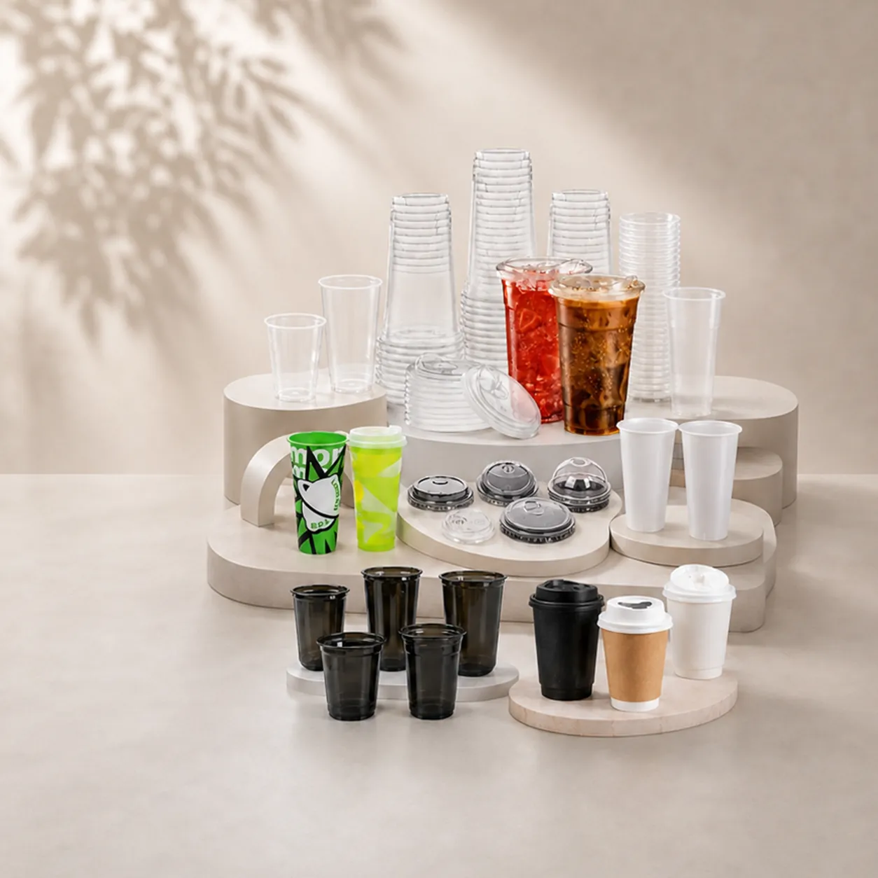 Clear, printed and black cups alongside lids